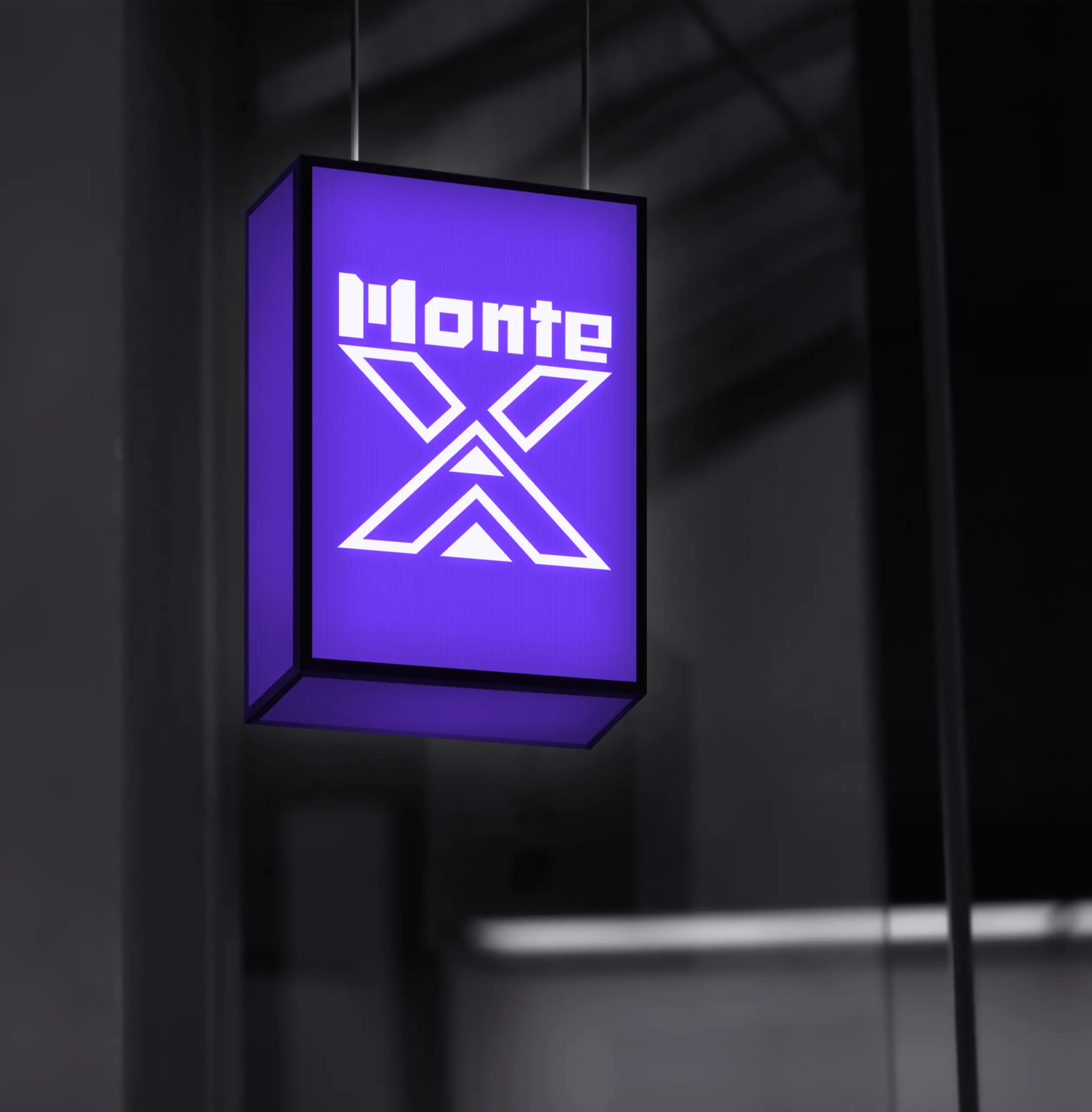Logotipo de Monte X iluminado en caja de luz